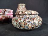 two vases that have been made out of mosaic glass