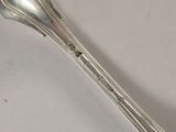 a spoon and fork on a table with a white background