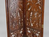 an old wooden screen with carvings and carvings on it