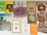a lot of books that are on the table