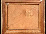 an image of a picture of a wooden frame with a bird on it
