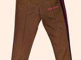 the children ' s pants are brown with a pink stripe on the side