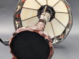 pair of antique stained glass lamps with a black base and a white shade