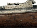 an old gun with a wooden handle on a white background