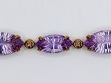 an image of a close up of a bracelet with purple stones