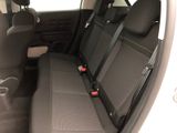 the back seats of a car with a black seat belt