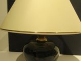 a lamp that is sitting on a table in a room