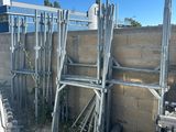 a lot of metal scaffolding on the side of a building