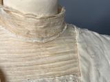 a dress on a mannequin with lace on it