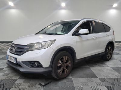 the white honda cr - v is parked on a checkered floor