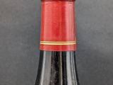 a bottle of wine that is sitting on a table