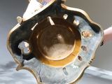 a close up of a metal object with a hole in it