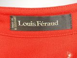 the label on the back of a red dress
