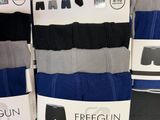three pairs of men ' s boxer briefs are on display in a store