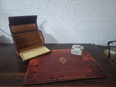 a book and dice on a table next to a lamp