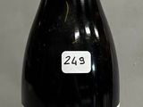 a bottle of wine sitting on a table with a label on it