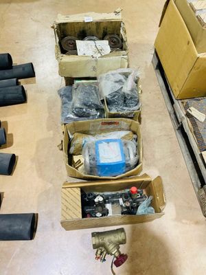 many boxes of assorted items sitting on the floor
