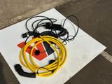 a yellow hose and a black hose on a white piece of paper