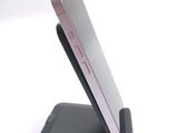 a cell phone that is sitting on top of a stand