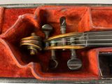 a violin that is in a case on a table