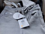 a close up of a pair of pants with a price tag on it
