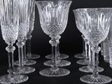 a lot of wine glasses that are sitting on a table