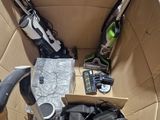 a box full of skis and ski poles in it