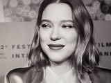 black and white photo of a woman in a suit and tie