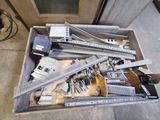 a box full of assorted electronic equipment on the floor