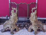 two ornately decorated fireplace screens sitting on the floor