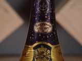 a close up of a bottle of wine on a table