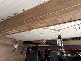 a light hanging from the ceiling above a bar