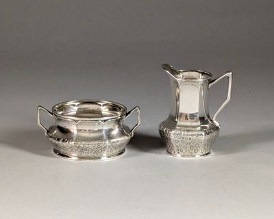 pair of silverplated sugar and creamers with handles