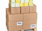 boxes stacked on a pallet with a barcode on top of them