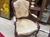a chair that is sitting in the middle of a room