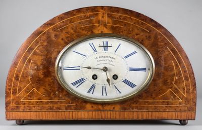 a wooden clock with roman numerals on the face