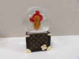 a snow globe with a person inside of it on a table