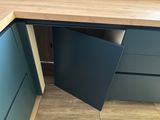 an image of a kitchen cupboard with a door open