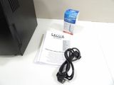 an image of a desktop computer and power cord on a desk