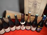 several bottles of wine are lined up on a table