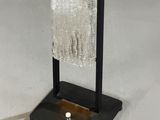 a glass towel rack with a glass towel on it