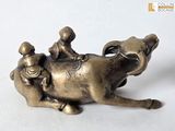 a bronze statue of a horse with two children riding on it
