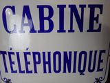 a blue and white sign that says cabin telephone