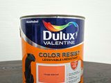 a close up of a can of paint on a table