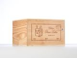 a wooden box that has a wine label on it