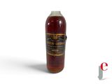an image of a bottle of liquor sitting on top of a white surface