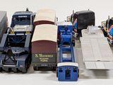 a lot of toy trains that are sitting on a table