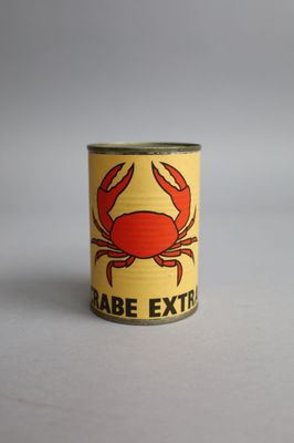 an image of a can with a crab on it sitting on a table