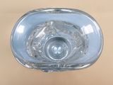 a clear glass vase with a circular design on it