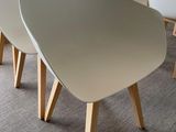 four chairs that are sitting in a room together